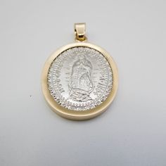 Crafted with solid 14k gold bezel and sterling silver base. Religious image of ‘Nuestra Señora de Guadalupe’ on the front of the medal. Large size allows for easy wearing and outstanding visibility at any distance. Comes in an attractive display box making it an excellent gift idea for religious occasions. Hypoallergenic construction designed to last a lifetime without tarnishing or fading its colors over time. This is a beautiful Medalla de la Viren de Guadaupel. Made from the highest quality s Religious Images, Box Making, Large Size, Sterling Silver, Silver, Gold, Gifts, Color