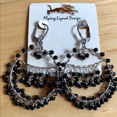 Pretty Sterling Silver Earrings With Black Beads By Flying Lizard Design. 2.5” Long. Adjustable Silver Beaded Chandelier Earrings, Black Beaded Metal Dangle Earrings, Black Metal Jewelry With Dangling Beads, Black Metal Clip-on Earrings, Black Party Chandelier Earrings With Dangling Beads, Handmade Black Dangle Clip-on Earrings, Handmade Black Sterling Silver Hoop Earrings, Black Beaded Dangle Chandelier Earrings, Black Handmade Sterling Silver Hoop Earrings