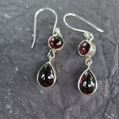 Red Garnet exclusively Earrings in Sterling Silver-Garnet jewelry-Christmas jewelry-Remarkable Earrings-Gift Dimension: 1.5 in long Stone 9 mm x 6 mm sterling silver Exclusive jewelry gift Elegant Round Christmas Earrings, Round Earrings For Christmas Anniversary, Red Earrings For Christmas Formal Occasion, Red Earrings For Christmas Formal Events, Red Christmas Earrings For Formal Occasions, Elegant Christmas Anniversary Earrings, Formal Dangle Garnet Earrings, Formal Garnet Dangle Earrings, Matching Earrings Jewelry For Christmas Anniversary