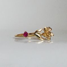 Our special collection of birth flower rings are inspired by the love of wearing something meaningful. Each birth flower is adorned with that month's birthstone. July's birth flower is Water Lily and the birthstone is ruby. Materials: 14K solid gold 2mm natural ruby 1.1mm band thickness ** This item is specially made for you. Please allow 1-2 week lead time. Shipping:Domestic: Free standard shipping within the U.S.International: Free standard shipping for orders over $200 Customization:- Interes Fine Jewelry Birthstone Flower Promise Ring, 14k Rose Gold Flower Ring With Birth Flower, 14k Gold Flower Ring With Birth Flower, Fine Jewelry Flower-shaped Birthstone Promise Ring, 14k Gold Birth Flower Promise Ring, Yellow Gold Flower Ring With Birthstone For Gift, Yellow Gold Flower Promise Ring For May Birthstone, 14k Yellow Gold Flower Ring With Birthstone, Flower Shaped Birthstone Ring For Anniversary