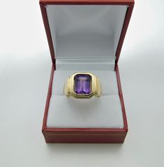 Gemstone: Amethyst Treatments: None Specifications: 10x8mm, 3.05 carats Color: As shown. Clarity: Transparent, no visible inclusions Cut: Emerald cut Origin: Brazil This is a stunning amethyst. Please note: these rings are made to order, so you will notice that all the center stones are shown positioned on the ring mounting. This is a fine and classy example of what a bold masculine ring should look like. Perfect for a man, yet not too masculine that a woman could not get away with wearing it. T Classic Amethyst Ring With Rectangular Stone, Classic Amethyst Ring With Rectangular Stone For Gift, Purple Emerald Cut Ring For Formal Occasions, Purple Emerald-cut Ring For Formal Occasions, Formal Purple Rings With Rectangular Stone, Purple Baguette Cut Rings For Formal Occasions, Formal Purple Emerald Cut Ring, Classic Yellow Gold Rectangular Amethyst Ring, Octagon-shaped Amethyst Ring For Formal Occasions