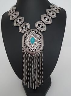 Necklace with details of rhinestones and turquoise stone, a unique boho necklace made of metal alloy silver plated unique gift Collier avec des détails de strass et de pierre turquoise, un collier boho unique en alliage de métal plaqué argent cadeau unique Halskette mit Details aus Strass und türkisfarbenem Stein, eine einzigartige Boho-Halskette aus Metalllegierung versilbert einzigartiges Geschenk Halskæde med detaljer af rhinsten og turkis sten, en unik boho halskæde lavet af metallegering sø Bohemian Pendant Chain Necklace For Festival, Bohemian Silver Metal Chain Necklace, Bohemian Blue Jewelry With Silver Chain, Silver Bohemian Metal Necklace, Bohemian Blue Necklace With Silver Chain, Blue Bohemian Necklace With Silver Chain, Festival Silver Necklace With Jewels, Silver Jewelry With Jewels For Festivals, Bohemian Metal Jewelry With Silver Chain