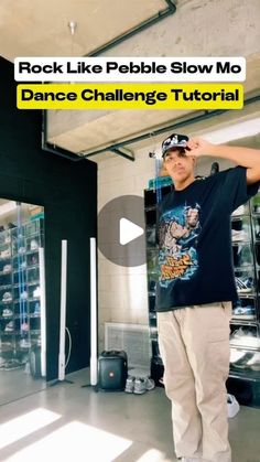 a man standing in front of a large display case with the words rock like pebble slow mo dance challenge