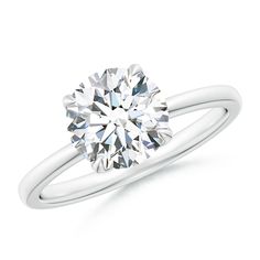 a round cut diamond engagement ring on a white background with the center stone in the middle