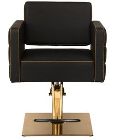 a black chair with gold trimmings on the back and foot rests against a white background