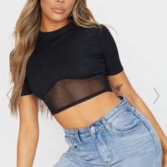 Add An Edge To Your Look With This Crop Top. Featuring A Black Ribbed Material With A Mesh Underbust Design, Wear This Crop Top With High Waisted Jeans For A Cool And Casual Vibe. Length Approx 39cm/15.5" (Based On A Sample Size Uk 8) Model Wears Size Uk 8/ Eu 36/ Aus 8/ Us 4 Model Height - 5ft 5” Short Sleeve Crop Top For Club In Spring, Spring Short Sleeve Crop Top For Club, Black Fitted Top For Club, Black Mesh Crop Top For Summer, Summer Black Mesh Crop Top, Black Stretch Mesh Top For Club, Chic Fitted Mesh Crop Top, Black Sheer Stretch Crop Top, Black Fitted Crop Top For Party