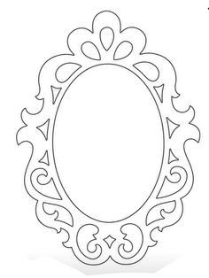 a paper cutout of an oval frame with scroll work on the edges and bottom