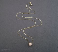 "New and exclusive to Benati. A very elegant round bead necklace, floating gracefully on a dainty solid 14k gold chain. Crafted to perfection in 14k solid gold. The pendant is hanged on a elegant, delicate and dainty gold 'box' approx. 0.6mm chain. if you wish for a thicker chain approx. 0.8mm chain, you can choose so at the checkout process. The pictures are of the approx. 0.6mm gold chain. You or your friend will look super fine with this new exclusive design - by Benati. The size of the round Elegant Gold Beaded Necklace With Tiny Beads, Elegant Gold Chain Jewelry With Round Beads, Elegant Yellow Gold Chain Necklace With Gold Beads, Elegant Yellow Gold Beaded Necklace, Gold Pendant Necklace With Tiny Beads, Elegant Pendant Necklace With Tiny Beads, Minimalist Gold Beaded Necklace For Wedding, Gold Beaded Pendant Necklace With Tiny Beads, Elegant Pendant Jewelry With Tiny Beads