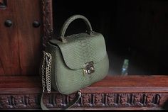 EMILY  Genuine python skin top handle bag  Color: khaki Size: 25/19/12 cm (9.84/7.48/4.72 inches)  Handmade in Bali with lots of love Face: genuine python skin Lining: eco suede  Handmade in Bali  with lots of love   This is a made to order item, usually it takes from 1-2 weeks to ship it depending on tailors capacity and Bali local holdays If you need any adjustments please feel free to message me NOTE:  we use one pattern  but each garment is unique and is slighly different, as it is 100% hand Elegant Formal Snake Print Bag, Elegant Snake Print Tote Bag, Elegant Green Crocodile Pattern Satchel, Elegant Rectangular Bag With Snake Print, Elegant Rectangular Shoulder Bag With Snake Print, Elegant Rectangular Snake Print Shoulder Bag, Elegant Snake Print Rectangular Bags, Elegant Rectangular Snake Print Bag, Elegant Rectangular Snake Print Bags