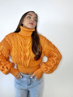 Cropped soft women's hand knit fall sweater in merino wool mixture, with long sleeves and a high turtleneck collar. The photo shows a merino wool mixture pullover in color 837. Model's height is 170cm, sweater size S- M. You can order this sweater in any color shown in the palette in the photo and in your size: XS - S: length - 45 cm, width - 50 cm. S - M: length - 46 - 47 cm, width - 52 - 53 cm. M - L: length - 47-48 cm, width -54 - 56 cm. XXL: length - 50 cm, width - 57-58 cm. XXXL: length - 52-53 cm, width - 60 cm. You can create a sweater according to your measurements, just enter them in the personalization section Fitted Cable Knit Sweater For Fall, Fitted Cozy Cropped Sweater For Fall, Cozy Fitted Cropped Sweater For Fall, Fitted Cropped Acrylic Sweater For Fall, Fitted Acrylic Cropped Sweater For Fall, Knitted Long Sleeve Sweater For Fall, Fitted Chunky Knit Acrylic Sweater, Orange Long Sleeve Sweater For Winter, Orange Long Sleeve Winter Sweater