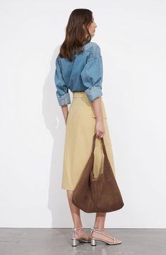 An adjustable D-ring belt and cargo pocket add utilitarian elements to a nonstretch midi skirt finished with an asymmetric hem for contemporary appeal. Attached belt Cargo flap-patch pocket 55% hemp, 45% cotton Dry clean or machine wash, line dry Imported Spring Utility Style Belted Skirt, Spring Utility Belted Cargo Skirt, Utility Skirt With Multiple Pockets For Work, Fall Workwear Cargo Skirt With Belt Loops, Utility Cargo Skirt With Patch Pockets For Work, Utility Cargo Skirt With Pockets For Work, Spring Workwear Cargo Skirt With Pockets, Chic Cargo Skirt With Pockets For Work, Casual Belted Cargo Skirt For Work