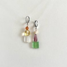 Handmade with sterling silver huggie hoops, 14k gold filled posts, and glass and sea glass beads, these earrings are a serene yet colorful vibe. These are perfect if you want to add a pop of color to any outfit and you don't like earring posts poking your neck. The lightweight materials don't pull your earlobe or feel heavy.  2" from top of hoop to bottom of earring. Made of tarnish resistant 14k gold / sterling silver filled surgical steel to ensure the highest quality without any skin-irritati Homemade Bead Earrings, Mismatch Earrings Ideas, Mis Matched Earrings Studs, Vintage Glass Jewelry With Matching Earrings, Bead Earrings Diy, Mismatched Dangle Earrings, Handmade Multicolor Glass Earrings, Sea Glass Beads, Glass Bead Earrings