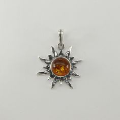 These is a beautiful Sterling Silver Pendant with Amber. The pendant is made out of solid 925 Silver and there is no nickel or other substances causing most allergies. This makes the pendant hypo allergenic. Size of the Pendant in total - with the bail 3.3 x 2.4 cm or  1.30 x 0.94 inch You will receive the item in a gift box - perfect to surprise someone or yourself. Usually we ship on the same day we receive the payment for the order. We want you to be happy with your purchase. If you do not li Silver Baltic Amber Necklace With Polished Finish, Silver Baltic Amber Jewelry As Gift, Silver Baltic Amber Jewelry For Gift, Nickel-free Round Amber Jewelry, Amber Sterling Silver Pendant Jewelry, Amber Sterling Silver Round Pendant Jewelry, Amber Polished Sterling Silver Jewelry, Amber Sterling Silver Jewelry With Polished Finish, Amber Pendant Jewelry Stamped 925