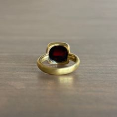 Rich wine hues flash from the depths of this regal, high-profile garnet ring. 18k yellow gold Garnet 10mm x 10mm (3/8" x 3/8") The top of the stone sits 3/8" off the finger Organic Style, Newport Ri, Garnet Ring, Garnet Rings, Newport, Garnet, Flash, Fine Jewelry, Yellow Gold