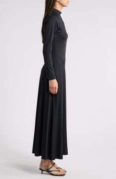 Asymmetric seams lend modern style to this versatile maxi dress boasting sumptuous stretch for event-ready comfort. 54 1/2" length (size Medium) Back keyhole with button-and-loop closure Mock neck Long sleeves Unlined 87% nylon, 13% spandex Dry clean Imported Formal Stretch Maxi Dress With Bias Cut, Fitted Maxi Dress With Side Slits For Work, Formal Full-length Bias Cut Maxi Dress, Full Length Maxi Dress With Side Slits, Fitted Solid Maxi Dress With Side Slits, Solid Elastane Maxi Dress, Solid Color Elastane Maxi Dress, Sleek Stretch Floor-length Dress, Stretch Full Length Midi Dress For Evening