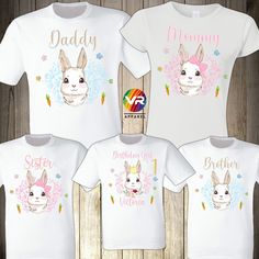 "Bunny Family Shirts PLEASE CHECK CHART SIZE FOR ACCURATE SIZE SELECTION. ♥ Man WHITE T-shirts * Youth WHITE T-Shirts ✔Brand: Fruit of the Loom *5 oz., pre-shrunk 100% cotton *High-density fabric for exceptional print clarity *Seamless 1x1 ribbed collar *Shoulder-to-shoulder taping *Double-needle stitched sleeves, bottom hem and front neck *Quarter-turned ---------------------------------------------------------------------------------------------------------------------------------------------- White Family Matching T-shirt, White Crew Neck Shirt For Family, White Crew Neck Shirt For Family Occasions, Cute Crew Neck Top For Family Occasions, Cute Crew Neck Top, White Tops With Name Print For Family, Family Matching Shirts With Funny Print, Easter Graphic Print Short Sleeve Tops, Cute White Shirt For Family Events