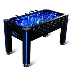 a foosball table with blue lights on the top and black legs, in front of a white background