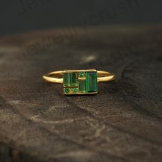 Multi Gemstone Ring, 18k Solid Gold, Baguette Emerald Statement Ring, Engagement Ring, Art Deco Ring, Women's Ring, Family Birthstone Rings Main Stone: Emerald ( Lab-Created ) Stone Color: Green Stone Shape: Baguette & Round Birth Month: May S I L V E R J E W E L R Y C A R E Silver is not the best friend of oxygen and sulfur; it can be oxidized and tarnished from time to time it is the nature of silver. To keep the silver shiny and prevent it from oxidizing fast, we would recommend the following Emerald Statement Ring, Engagement Ring Art Deco, Birthstone Rings, Multi Gemstone Ring, Fancy Gifts, Ring Art Deco, Deco Ring, Art Deco Ring, Birth Month