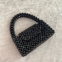 ✨ Welcome to my store beauty💄 ✴ Stylish crystal bead bag that will add beauty to your beauty.✴  I love making my custom bead bags for you. I produce from quality beads and unbreakable threads.  My top quality beads will never peel or fade. I make it from quality thread and beads. Everything is for you...💕 💕 I hope you make good memories with this bag. ☆ You can use it as a night bag in the evenings, or you can provide a cool look with this bag in daily life.  -You can wipe my bags with a damp cloth, it will never hold permanent dirt. - My bags are 100% handmade. The production of these bags, which I produce with my own labor, takes 5 days.  -This size is suitable for your bag, phone, key chain, card holder and small make-up items.  -The size in the picture is 7.8 inc x 4.3 inc x3.1 inc Luxury Black Beaded Evening Bag, Gift Black Beaded Shoulder Bag, Handmade Black Handheld Evening Bag, Black Beaded Rectangular Clutch, Black Beaded Evening Bag For Gift, Black Beaded Evening Bag As Gift, Evening Shoulder Bag With Black Beads Rectangular Shape, Evening Rectangular Shoulder Bag With Black Beads, Black Handmade Evening Bag For Party