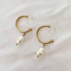 Pearl - Clip-On Earrings Cheap White Pearl Clip-on Earrings, Cheap Clip-on Pearl Earrings For Wedding, Cheap Gold Plated Clip-on Earrings, Affordable White Pearl Clip-on Earrings, Luxury Pearl Clip-on Earrings For Anniversary, Luxury Pearl Drop Clip-on Earrings For Parties, Cheap Pearl Clip-on Earrings For Women, Luxury Small Hoop Clip-on Earrings, Cheap Trendy Clip-on Earrings