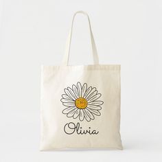 a white bag with a yellow daisy on it that says,'alvia '