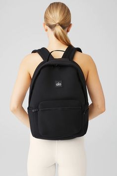 Stow Backpack - Black/Silver | Alo Yoga Sporty Backpack With Functional Pockets For On-the-go, Black Nylon Backpack With Water Bottle Pocket, Sporty Softback Backpack For Everyday Use, Sporty Everyday Softback Backpack, Sporty Nylon Softback Backpack, Sporty Everyday Nylon Backpack, Sporty Backpack With Functional Pockets For Everyday Use, Sporty Black Backpack For Commuting, Modern Nylon Sports Backpack