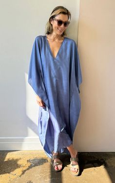 Our v neck sari caftan in a gorgeous blue handwoven silk A chic, easy oversized style   Model is size 2/4 and 5'9 As this is a handmade product we recommend dryclean for silk Color: Blue —  Width 45" flat across Length 50" —  Handwoven Silk —  One size fits all - (fits up to size 16) Chic Silk V-neck Kaftan, Spring Linen V-neck Kaftan, Casual V-neck Relaxed Fit Kaftan, Silk V-neck Kaftan For Beach Cover-up, Summer Blue Kaftan With Batwing Sleeves, Blue Batwing Sleeve Kaftan For Summer, Casual Linen V-neck Kaftan, Relaxed Fit V-neck Maxi Dress Unlined, Relaxed Fit V-neck Unlined Maxi Dress