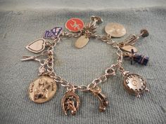 **most charms are marked sterling, but not all. *bracelet itself is hallmarked sterling(see photos). inside circumference of chain: approximately 6 1/2". total weight: 31.3 grams. very cute and sweet charm bracelet! free econo shipping. Antique Bracelets With Dangling Charms As Gift, Antique Bracelets With Dangling Charms For Gift, Antique Style Bracelets With Dangling Charms As Gift, Antique Charm Bracelet As Gift, Antique Hallmarked Charm Bracelet As Gift, Sterling Silver Bracelets With Vintage Charm For Gift, Sterling Silver Bracelets With Vintage Charm As A Gift, Vintage Sterling Silver Bracelet With Charm, Silver Round Charm Bracelet