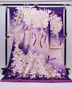 A beautiful wedding Uchikake Kimono with extensive embroidery.  This purple long sleeved Japanese dress is made of high quality silk with floral details.  Enjoy the luxury and quality of Japanese Kimono. Vintage Japanese Kimonos are a unique and stunning piece of Japanese culture. Kimono's are made completely by hand and are considered a wearable work of art. Item: Silk Furisode Kimono Robe No. yukn381 Size: US  L   /  Length  76.7inch (195cm) , Width 26.7inch (68cm) Condition: Used, Very Good.P Purple Kimono Outfit, Wedding Kimono With Floral Embroidery, Long Floral Embroidered Kimono For Wedding, Traditional Wedding Kimono With Floral Embroidery, Traditional Pink Kimono For Wedding, Long Embroidered Kimono For Wedding, Wedding Embroidered Kimono With Kimono Sleeves, Traditional Pink Wedding Kimono, Traditional White Kimono For Wedding