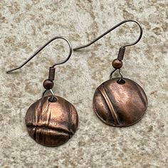 A smaller version of the round freeform folded earring that goes well with the round foldformed pendant. 3/4" diameter Drop from ear approximately 1 1/2 inches. Bronze Round Earrings, Bronze Copper Round Earrings, Round Electroformed Metal Earrings, Electroformed Round Metal Earrings, Nickel-free Copper Circle Earrings, Nickel-free Round Pendant Metal Earrings, Artisan Bronze Round Earrings, Nickel-free Bronze Circular Earrings, Unique Bronze Round Earrings