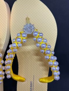 Perfect for your special day or just Walk at the beach with a pair of comfy & cute flip flops, great for pool and walks  Made with rhinestones and Pearls satin lace its super comfortable The pearls were sewing by hands using clear jewelry cord 0.40 mm Color yellow  Size 8 This is an Old Navy Flip Flops can be made with Havaianas but it would cost more! Can be made in different colors and sizes. Smoke and pet free Gold Rhinestone Flip Flops For Vacation, Elegant Gold Flip Flops For Beach, Elegant Gold Flip Flops For The Beach, Elegant Adjustable Flip Flops For Beach, Summer Rhinestone Sandals As Gift, Summer Sandals With Rhinestones As Gift, Yellow Open Toe Sandals With Rhinestones, Adjustable Rhinestone Flip Flops For The Beach, Adjustable Rhinestone Toe Post Flip Flops