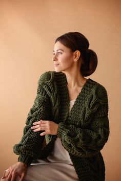 "Meet green chunky knit cardigan! Beautiful delicate green chunky sweater with braids! Cozy and stylish. Unique designed long sleeves. Soft and cozy finest quality green bomber jacket for woman. Wedding cover up is a unique piece for a cold wedding day that will keep you warm and make your look magical. A completely weightless wedding sweater, wraps you in a warm cloud. This is the perfect solution for autumn and spring, will make your look feminine and light. The pattern is so interesting that Green Cable Knit Cardigan For Fall, Green Cable Knit Long Sleeve Sweater Coat, Green Cable Knit Sweater Coat With Long Sleeves, Green Long Sleeve Cable Knit Sweater Coat, Winter Green Cable Knit Cardigan, Green Cable Knit Sweater Coat, Cozy Green Cable Knit Cardigan, Green Knitted Cardigan For Fall, Green Long Sleeve Knitted Cardigan