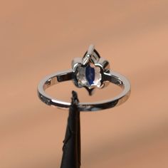 It is a lab sapphire ring. The main stone is 5 mm*10 mm marquise cut.weight about 1.18 carats. The basic metal is sterling silver and plated with rhodium. To change the metal to a solid gold (white/rose) or platinum is also available, please ask for a quotation if you want. You can also go to my shop Home for more elegant rings: https://www.etsy.com/shop/godjewelry?ref=hdr_shop_menu Sapphire is the September birthstone. More sapphire rings: https://www.etsy.com/shop/godjewelry?section_id=2071503 Marquise Sapphire Ring In White Gold, Marquise White Gold Sapphire Ring, White Gold Marquise Sapphire Ring, Fine Jewelry Marquise Sapphire Promise Ring, Marquise Sapphire Promise Ring Jewelry, Marquise Sapphire Ring With Cubic Zirconia For Promise, Marquise Sapphire Promise Ring, Marquise Sapphire Promise Ring In White Gold, Marquise Cut Sapphire Promise Ring