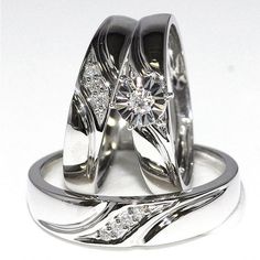 two white gold wedding rings with diamond accents