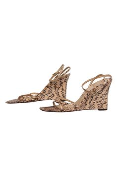 Slip into some slithering style this summer with these wedges from Kate Spade! Made of real snakeskin, these fierce wedges are perfect for bringing some safari chic vibes to your warm weather wardrobe. Pair with a miniskirt and bodysuit for a hot night out and you'll be sure to stun! Size 8 Leather snakeskin upper w/ strappy design Made in Italy Ankle strap closure Snakeskin wedge Leather sole and footbed w/ minor wear Original dustbag included Wedge 3.4" Chic Snake Print Sandals For Spring, Summer Leather Heels By Kate Spade, Kate Spade Leather Summer Heels, Kate Spade Leather Heels For Summer, Summer Casual Kate Spade Heels, Kate Spade Casual Summer Heels, Casual Kate Spade Heels For Summer, Kate Spade Summer Wedge Heels, Chic Kate Spade Summer Wedge Sandals