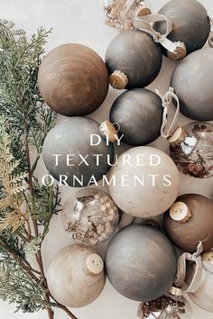 an arrangement of ornaments with text overlay that reads, diy textured ornaments