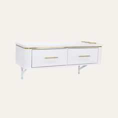 a white and gold sideboard with two drawers on the bottom, one drawer is open