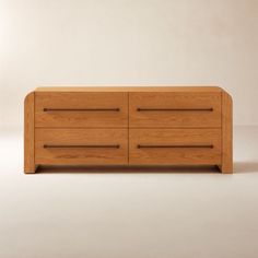 a wooden dresser with three drawers on one side