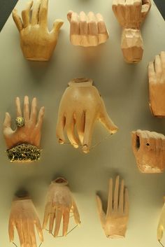 many different types of clay hands on display