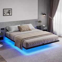 a bed with blue lights on the side and a white rug in front of it