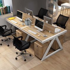 an office desk with two computer monitors and three chairs in front of it on the floor