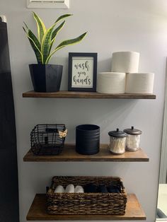 bathroom shelves with toilet paper and other items on them