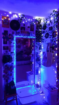 a bathroom decorated in purple and blue lights