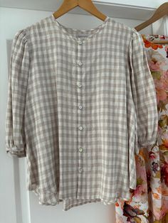 Gorgeous ladies button up linen gingham taupe blouse, featuring mother of pearl buttons. Made from 100% linen.  Bust - 59cm across Length - 59cm (shoulder to front hem) Sleeve length - 43cm Handmade in Armidale, NSW  PLEASE NOTE - model wears pink variation. Spring Plaid Linen Shirt, Summer Plaid Blouse With Button Closure, Spring Linen Tops With Placket, Summer Plaid Blouse With Buttons, Cream Linen Blouse For Spring, Spring Cream Linen Blouse, Spring Linen Button-up Blouse, Cream Linen Button-up Top, Spring Linen Shirt With Buttons