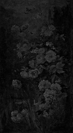 a black and white photo of flowers in the night sky with butterflies flying above it