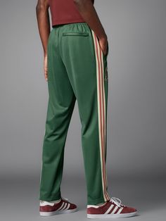 adidas Men's Soccer Mexico Beckenbauer Track Pants - Green | Free Shipping with adiClub | adidas US Sporty Green Pants With Elastic Side Panels, Green Sweatpants With Side Stripes For Streetwear, Green Bottoms With Side Stripes For Streetwear, Green Streetwear Pants With Side Stripes, Green Pants With Side Stripes For Streetwear, Green Side Stripe Pants For Streetwear, Casual Green Bottoms With Three Stripes, Adidas Jogging Bottoms With Side Stripes, Adidas Bottoms With Side Stripes For Jogging