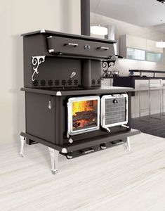 a stove top oven sitting inside of a kitchen