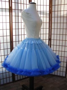 "This listing is for a custom order for a super-full double layer nylon organdy petticoat with satin waist and chiffon bottom ruffles. The pictured petticoat was designed for a 26.5\" (67,3 cm) waist and is 20\" (50,8 cm) long. It is displayed on a dress form with a 22\" (55cm) waist. You can choose any length you need. I will lengthen each of the tiers to achieve extra length. If you would prefer that I add another tier to achieve extra length, then the price will increase substantially. If you Blue Fitted Petticoat For Party, Fitted Organza Petticoat With Ruffles, Fitted Blue Tulle Petticoat, Blue Fitted Tulle Petticoat, Fitted Vintage Tulle Petticoat, Fitted Sheer Petticoat For Wedding, Fitted Tulle Petticoat With Ruffles, Sheer Fitted Petticoat For Party, Fitted Spring Organza Petticoat