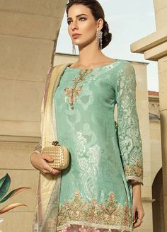 Lawn Suit with Embriodery in Turquoise Color embellished with thread embroidery. This dress is looking beautiful and easy to wear it. Shirt:Classy Lawn suit shirt in turquoise color is embellished with beautiful embroidery and print. The print is unique in style and looking so elegant. Shirt sleeves decor with lace. It includes daman and neckline embroidered patch. Trouser:Suit consist of trouser in pink color which is looking elegant. Trouser in pent ghrara style. Dupatta: Embroidered Lawn Suit Maria B Dresses, Gharara Pants, Suits Online Shopping, Desi Wear, Lawn Suit, Pants Short, Turquoise Fabric, Party Pants, Maria B