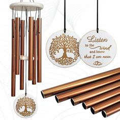 a wind chime with copper colored metal tubes and an engraved plaque that says listen to the